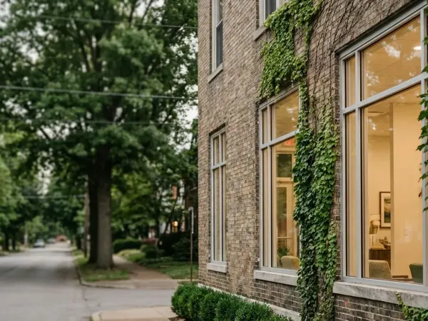 Modern independent medical practice in a converted Louisville brick building with ivy exterior and warm interior lighting