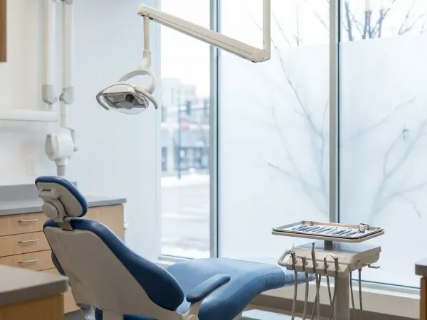 Modern dental consultation room in a Madison, WI dental practice with professional dentist reviewing treatment plan with patient